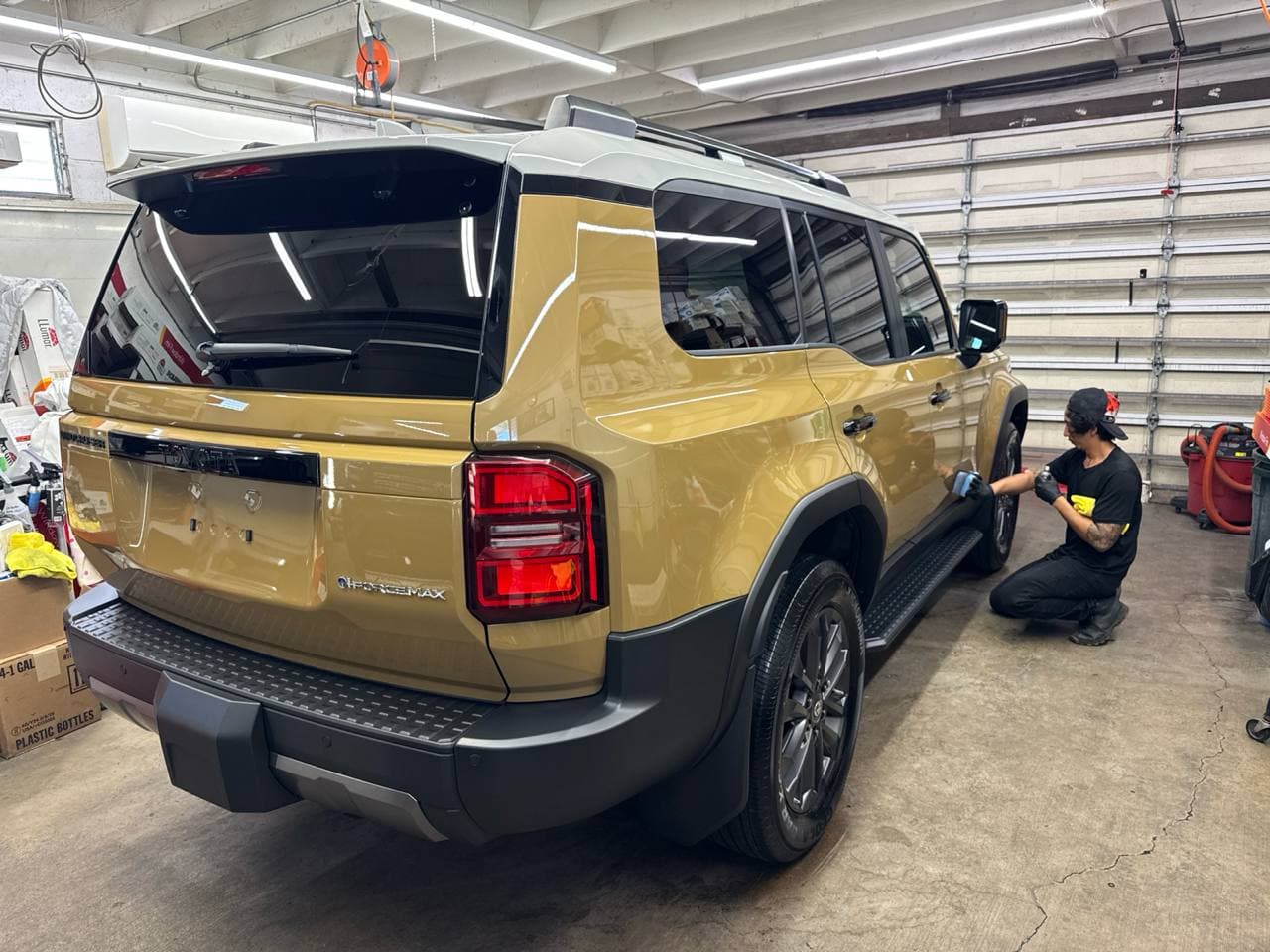 Ceramic coating being applied to a Toyota Land Cruiser at Custom Auto Accessories